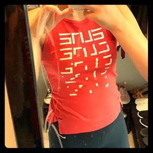 Red Nike shirt with white design on the front